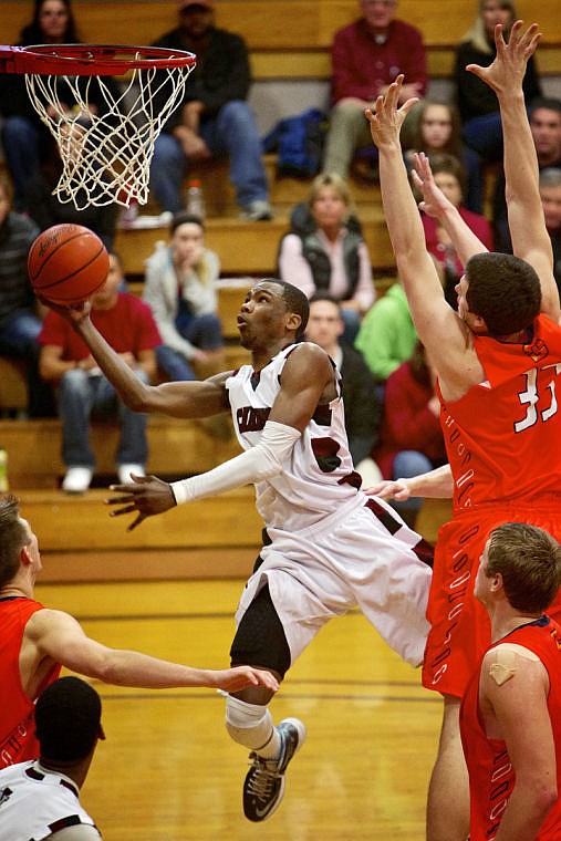 &lt;p&gt;JEROME A. POLLOS/Press North Idaho College's Jalil Abdul-Bassit goes up for a shot under the basket in between the Snow College defense.&lt;/p&gt;