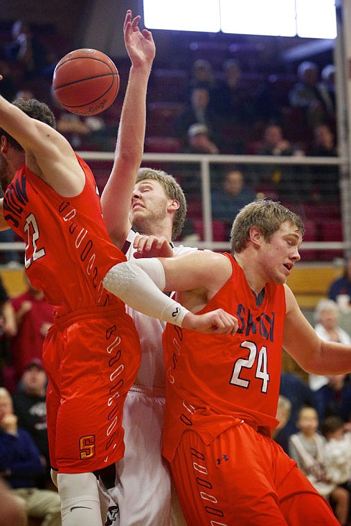 &lt;p&gt;JEROME A. POLLOS/Press Kaj Sherman from North Idaho College gets trapped between to Snow College players as they try to get to a rebound in the second half.&lt;/p&gt;