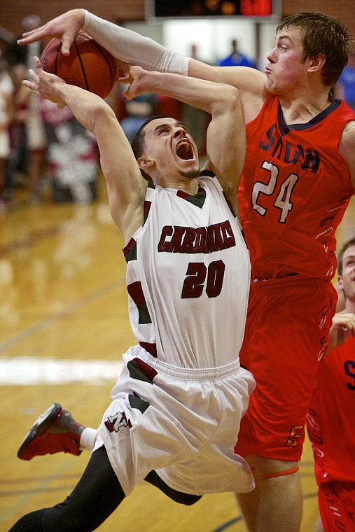 &lt;p&gt;JEROME A. POLLOS/Press North Idaho College's Mikey Hope gets blocked by Brock Smith from Snow College as he drives to the hoop Friday during the Region 18 tournament in Coeur d'Alene.&lt;/p&gt;