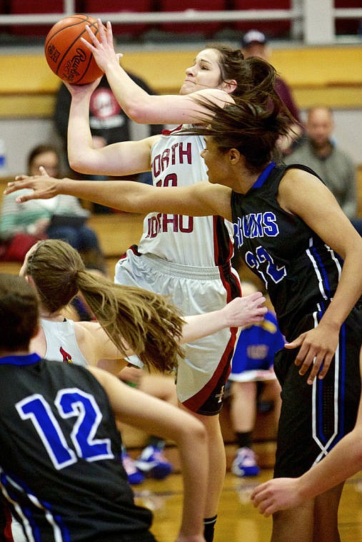 &lt;p&gt;JEROME A. POLLOS/Press North Idaho College's Mollie Kramer goes up for a shot as a Snow College defender attempts a block.&lt;/p&gt;