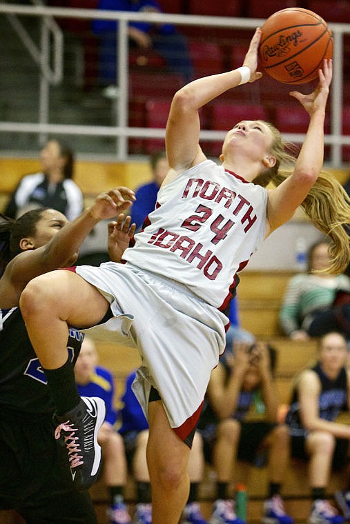 &lt;p&gt;JEROME A. POLLOS/Press North Idaho College's Georgia Stirton falls backwards as she was ran into by a Salt Lake Community College defender while making a shot Friday at the Region 18 tournament in Coeur d'Alene.&lt;/p&gt;