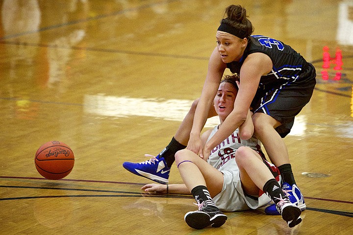 &lt;p&gt;JEROME A. POLLOS/Press North Idaho College's Katie Buskey falls into Bella Swan from Snow College at the end of a play in the first half.&lt;/p&gt;