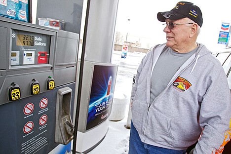 &lt;p&gt;Larry Roullier watches the pump Thursday as he fills the tank of his SUV in Coeur d'Alene with regular unleaded that was priced at $3.34 a gallon.&lt;/p&gt;