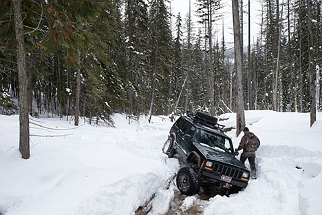 &lt;p&gt;John Schirmer walks back to his 2000 Jeep Cherokee after driving it over an embankment, popping out a ball joint and breaking the front axle, while wheeling with the North Idaho Trailblazers Saturday on private land near Mullan, Idaho.&lt;/p&gt;