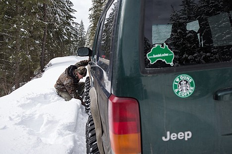 &lt;p&gt;Army veteran John Schirmer lets out air from his tires to increase traction after struggling through snow Saturday on a trail near Mullan, Idaho during an outing with the North Idaho Trailblazers.&lt;/p&gt;