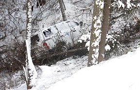 Sanders County Deputy Steven Spurr wrecked his SUV by sliding over an embankment on Buffalo BIll Road in Plains on last Thursday evening.