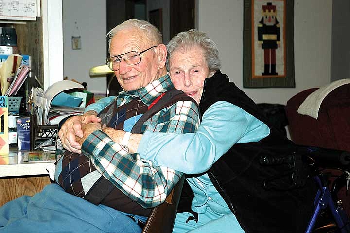 Many years later, they cuddle in their Desert Aire living room for a photo.