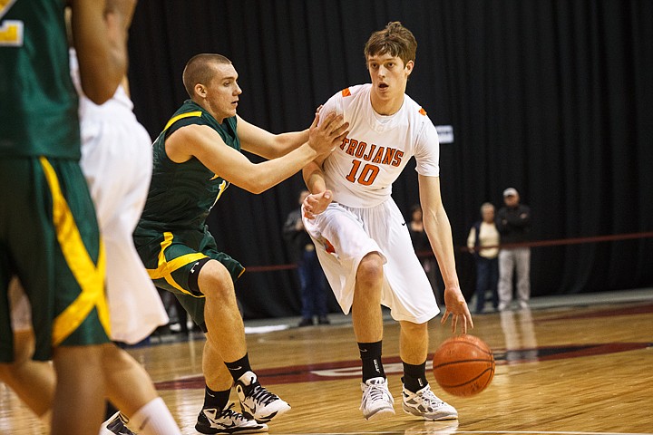 SHAWN GUST/Press

Seth Anderson, of Post Falls, (10) is shoved by Borah's Brett McCutchen while dribbling.