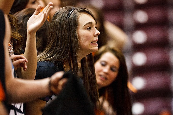 SHAWN GUST/Press

Brooke Italien, a sophomore at Post Falls High School, grits her teeth as regulation play comes to an end with the score tied at 51.