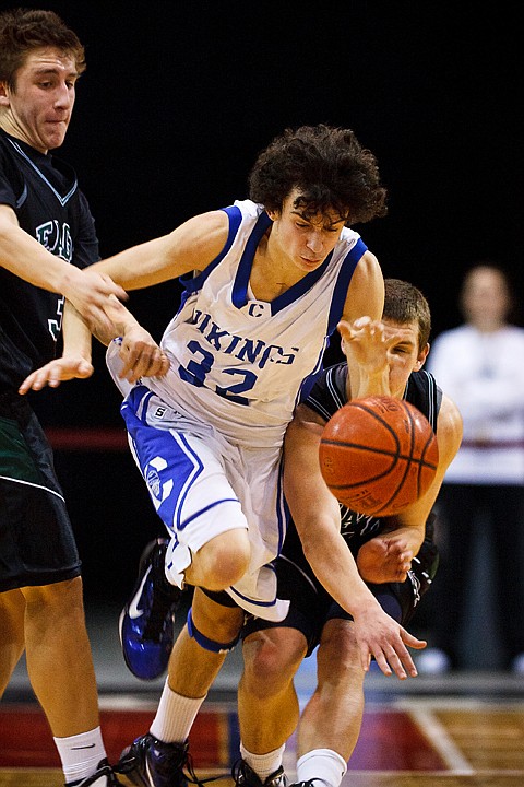 SHAWN GUST/Press

Vikings' guard Andrew Baracco drives between two Eagle defenders Thursday in the first half.