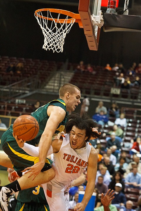 SHAWN GUST/Press

Post Fall High School's Marcus Colbert puts up a shot as Borah's Brett McCutchen collides with him Thursday in the second half of the 2011 Idaho State 5A Boys Basketball Tournament in Nampa.