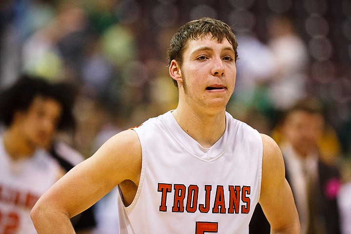 SHAWN GUST/Press

Connor Hill of Post Falls is frustrated as he walks after the court at the Idaho Center following an overtime loss to Borah High School.