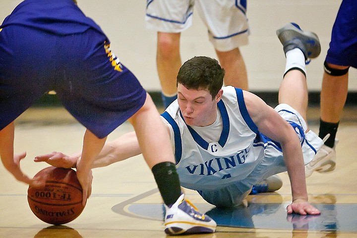 &lt;p&gt;Coeur d'Alene High's Jake Matheson dives for a loose ball during the Viking's 5A Region 1 tournament championship game against Lewiston Friday.&lt;/p&gt;