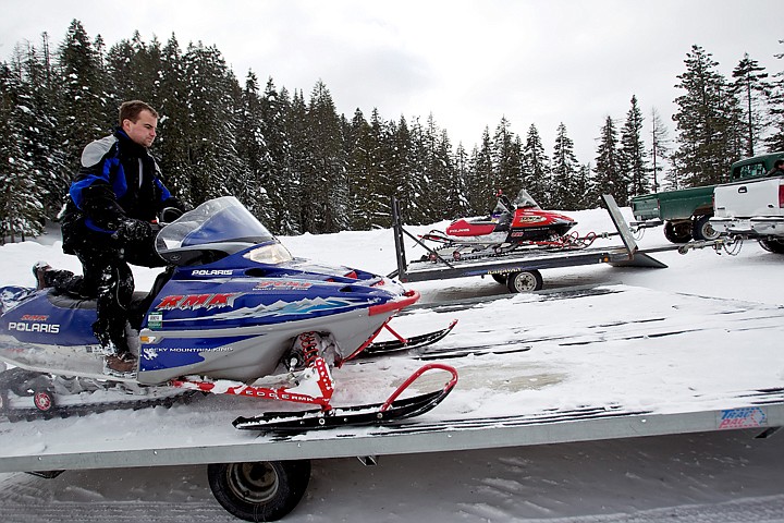 &lt;p&gt;Adam Fisher parks his snowmobile on a trailer after returning from the trail Friday.&lt;/p&gt;