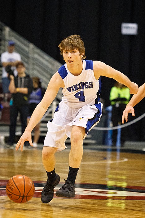 <p>Joe Roletto dribbles down the court in the first half against Highland.</p>