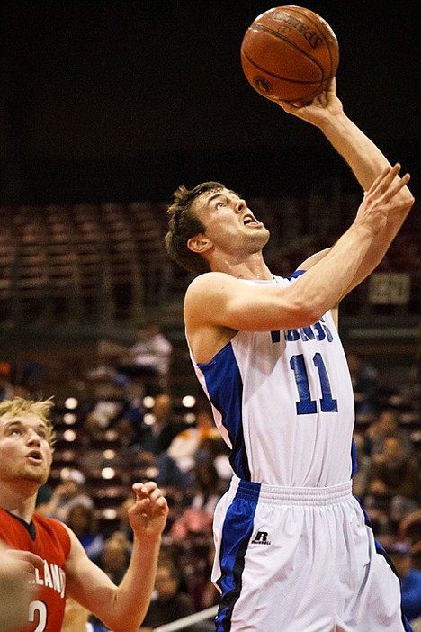 <p>The Vikings' Chad Chalich goes to the basket in the second quarter against Highland.</p>