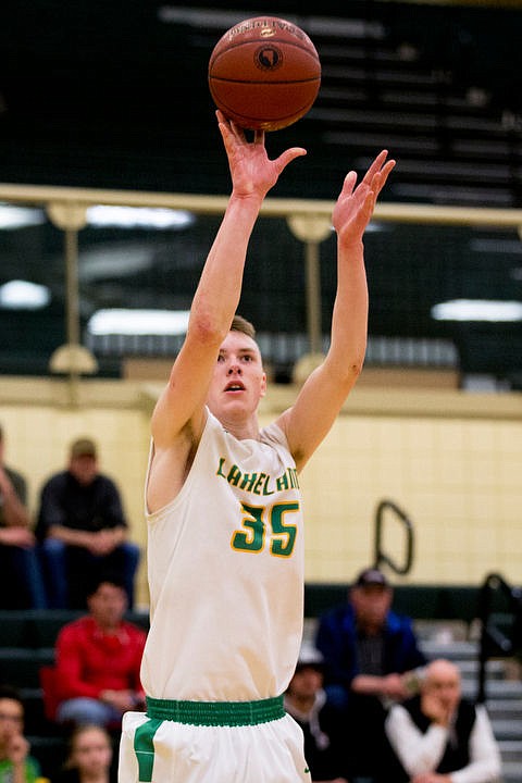 <p>Lakeland forward Andrew Knight shoots from the three-point line at the first 4A state basketball state game against Burley on Thursday, March 3, 2016 at Borah High School in Boise. Burley defeated Lakeland 56-45.</p>