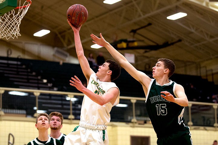 &lt;p&gt;Lakeland guard Dylan Knight soars to the basket as Burley point guard Justin Beazer defends at the first 4A state basketball state game on Thursday, March 3, 2016 at Borah High School in Boise. Burley defeated Lakeland 56-45.&lt;/p&gt;
