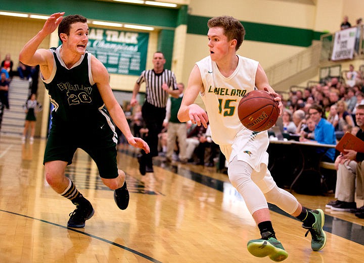 &lt;p&gt;Lakeland guard Kaden Davis drives to the key as Burley guard Britton Garrard defends at the first 4A state basketball state game on Thursday, March 3, 2016 at Borah High School in Boise. Burley defeated Lakeland 56-45.&lt;/p&gt;