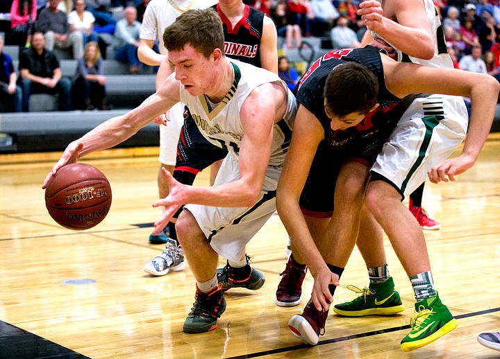 &lt;p&gt;St. Maries guard Jake Sieler scrambles with Soda Springs center Riley Harris on Thursday, March 3, 2016 in the first 2A state game at Capital High School in Boise, Idaho. The Lumberjacks defeated the Cardinals 45-42.&lt;/p&gt;
