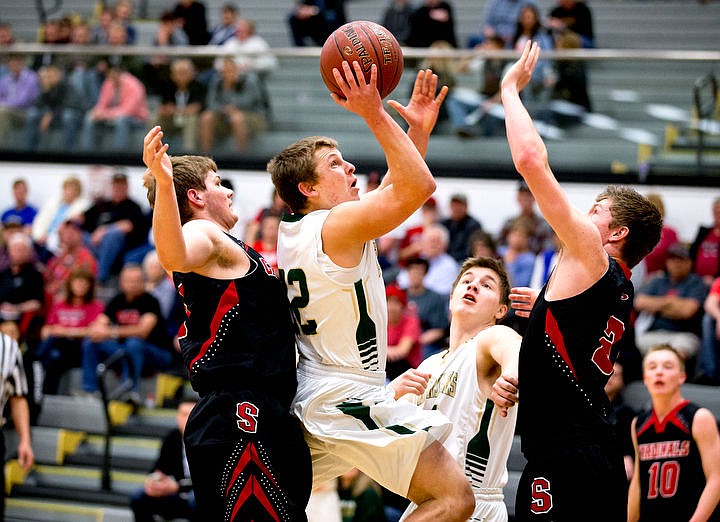 &lt;p&gt;St. Maries guard Dakota Wilson drives to the basket as Soda Springs forward Hyrum Brown, left, and Tanner Meyers defend on Thursday, March 3, 2016 in the first 2A state game at Capital High School in Boise, Idaho. The Lumberjacks defeated the Cardinals 45-42.&lt;/p&gt;