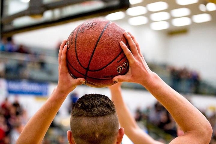 &lt;p&gt;St. Maries post Bryant Asbury holds the ball over his head as he looks for an open teammate to pass to on Thursday, March 3, 2016 in the first 2A state game at Capital High School in Boise, Idaho. The Lumberjacks defeated the Cardinals 45-42.&lt;/p&gt;