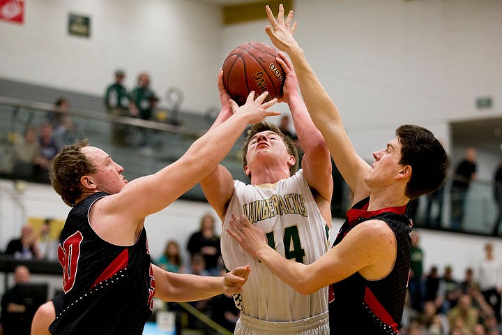 &lt;p&gt;St. Maries post Nate Masterson is fouled by Soda Springs guard Dylan Downs, left, and Will Kress on Thursday, March 3, 2016 in the first 2A state game at Capital High School in Boise, Idaho. The Lumberjacks defeated the Cardinals 45-42.&lt;/p&gt;