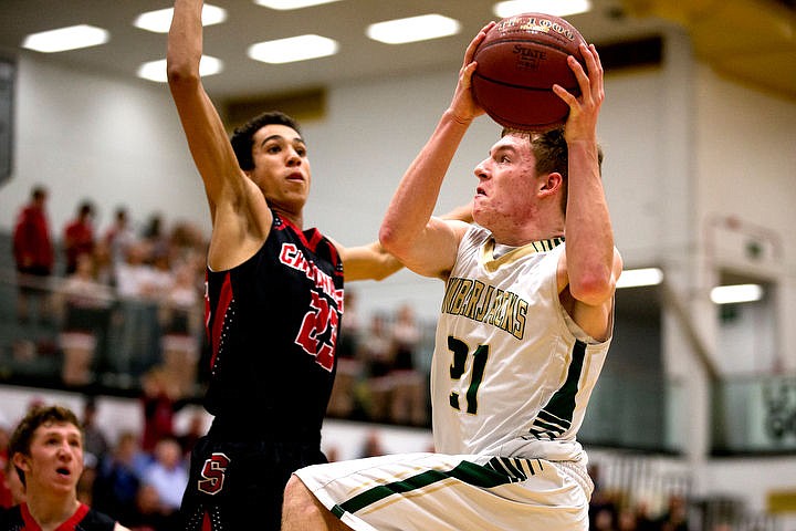&lt;p&gt;St. Maries post Kiefer Gibson drives to the basket while attempting a lay-up as Soda Springs forward Henry Workman defends on Thursday, March 3, 2016 in the first 2A state game at Capital High School in Boise, Idaho. The Lumberjacks defeated the Cardinals 45-42.&lt;/p&gt;
