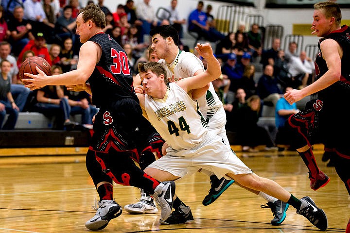 &lt;p&gt;St. Maries post Nate Masterson (44) reaches for a loose ball as Soda Springs guard Dylan Downs attemps to gain possession of it on Thursday, March 3, 2016 in the first 2A state game at Capital High School in Boise, Idaho. The Lumberjacks defeated the Cardinals 45-42.&lt;/p&gt;