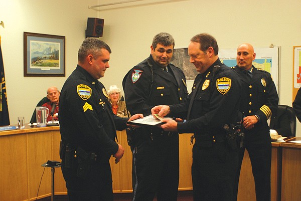 PPD Sgt. Wade Nash, left, and Tribal Officer Orsino Walker, middle, are awarded Certificate&#146;s of Highest Merit by PPD Assistant Chief John Stevens. Tribal Law and Order Chief Craig Couture is at right.