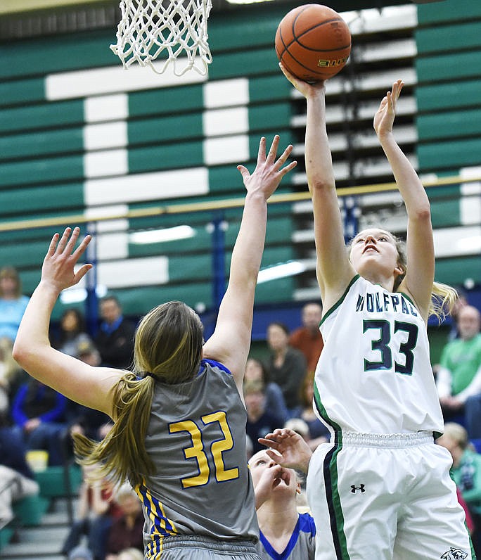 <p>Glacier's Kali Gulick shoots over Missoula Big Sky's Anna Gragg during the Wolfpack's 47-42 loss at Glacier on Thursday. (Aaric Bryan/Daily Inter Lake)</p>