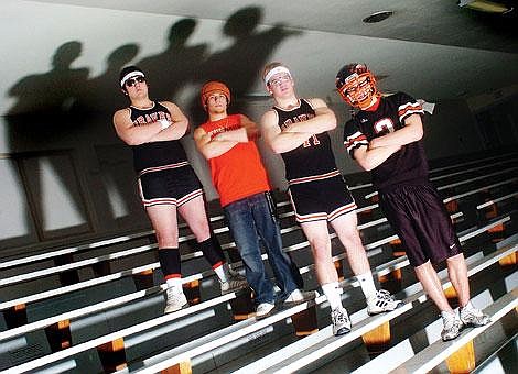 From left to right, Flathead High School seniors Tanner Osweiler, Foston Reilly, Cody Haugen and Corey Campbell make up the core of a rowdy Flathead student section. They always stand in the same order to increase Flathead&#146;s chances of victory. And they have one goal in mind. &#147;We make as much noise as possible,&#148; Campbell said. &#147;We want people to know Flathead is a hostile environment.&#148; Chris Jordan/Daily Inter Lake&lt;br&gt;Fan-demonium&lt;br&gt;Flathead fanatics give Braves a true home-court advantage