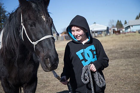 &lt;p&gt;Tanner Hageman, 12, smiles at Classy as he leads him around the pen on Saturday at Forever Young Therapeutic Ranch and Rescue in Hayden.&lt;/p&gt;