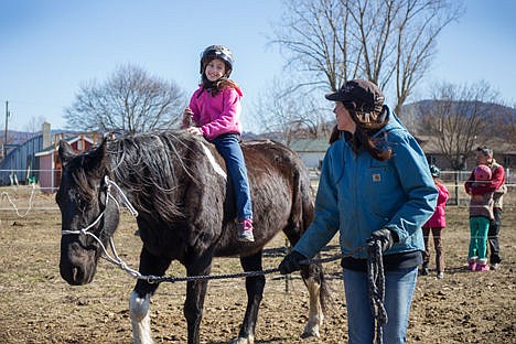 &lt;p&gt;Morgan Young, board member for the ranch leads Classy while Riley Hageman, 10, rides bare-back.&lt;/p&gt;