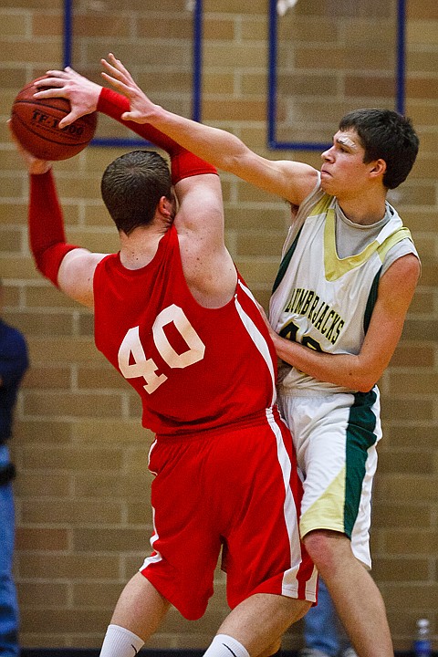 SHAWN GUST/Press

St. Maries' Ian Heath applies pressure to Wieser High's Spencer Chandler during the 3A state basketball tournament in Meridian.