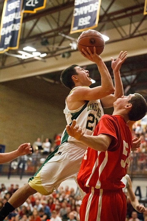 SHAWN GUST/Press

St. Maries' Jaden Guidry goes up and over a Weiser defender for a score on Friday.