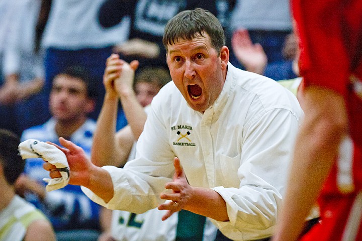 SHAWN GUST/Press

Head Coach for the St. Maries boys basketball squad Craig Wicks cheers after a score late in Friday's game against Weiser High School.