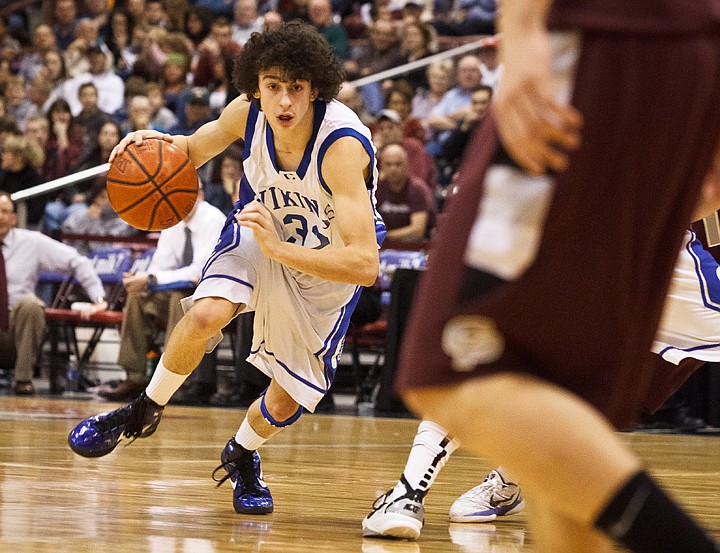 SHAWN GUST/Press

Coeur 'Alene's Andrew Baracco finds a lane to drive Friday in Nampa.