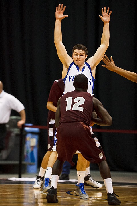 SHAWN GUST/Press

Senior guard for the Vikings Jake Matheson plays defense against Centennial's Daryl Robertson Friday at the Idaho Center in Nampa.