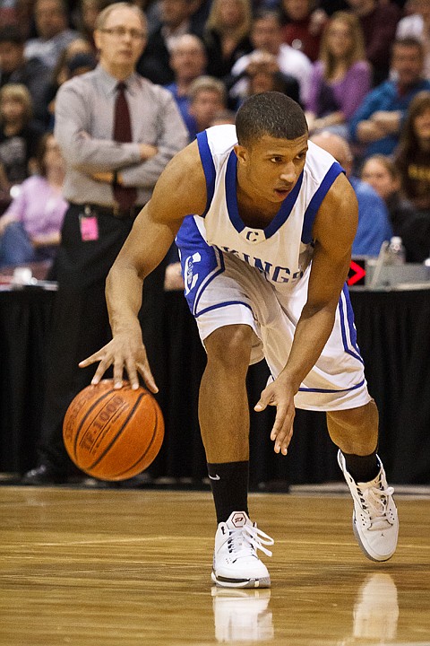 SHAWN GUST/Press

Coeur d'Alene's Deon Watson gets low as he makes a move on the court at the 5A state basketball tournament.