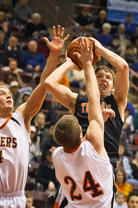 SHAWN GUST/Press

Post Falls High's Coonor Hill puts up a score in the second quarter against Idaho Falls Friday during the 5A state boys basketball tournament in Nampa.