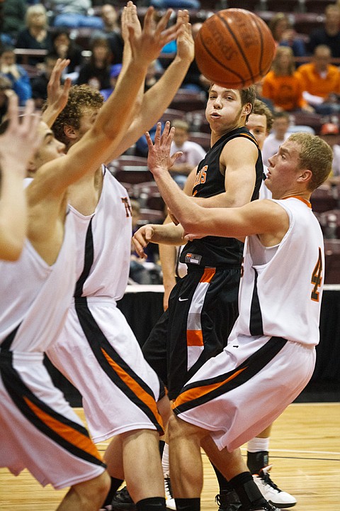 SHAWN GUST/Press

Connor Hill passes the ball through the defensive hands of Idaho Falls in the second quarter.