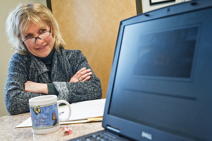 &lt;p&gt;Karen Durgen, principal at Holy Family Catholic School in Coeur d'Alene, watches a video that was produced for the school that she feels conveys the essence of the curriculum.&lt;/p&gt;