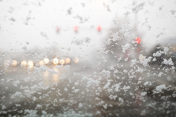 &lt;p&gt;SHAWN GUST/Press Large snowflakes gather on a windshield Thursday as snow flurries pass through Coeur d'Alene.&lt;/p&gt;