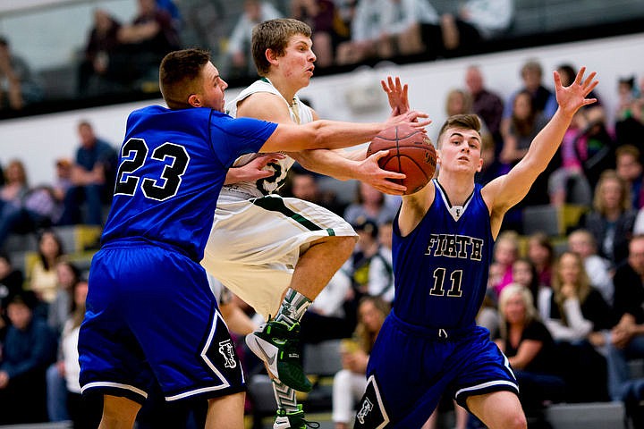 &lt;p&gt;St. Maries guard Dakota Wilson, center, attempts to get a pass off as Firth guard Dylan Holley (23) and Lucas Orme defend at the 2A state semifinal game on Friday at Capital High School in Boise.&lt;/p&gt;