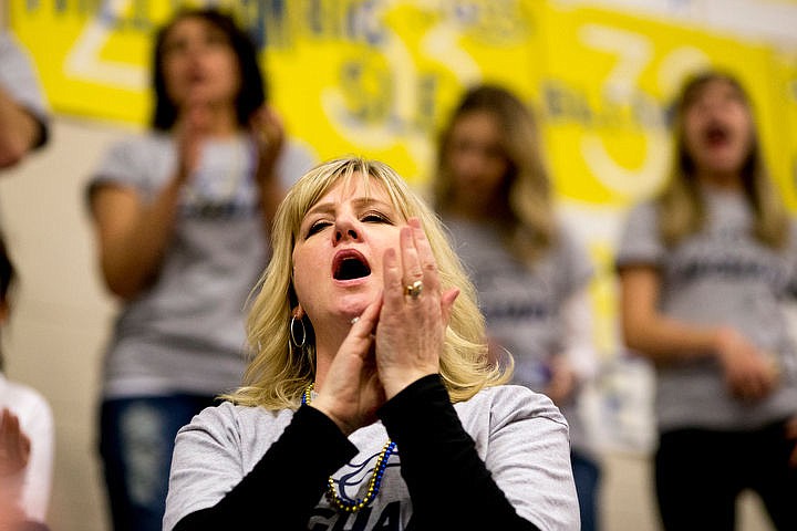 &lt;p&gt;Shari Symons, mother of Genesis Prep forward Caleb Symons cheers during the second half of the 1A Division II semifinal game on Friday, March 4, 2016 at Caldwell High School in Caldwell, Idaho. Genesis Prep fell to Council, 48-39, ending their chance at the state title. PURCHASE PHOTO: www.cdapress.com/photos&lt;/p&gt;