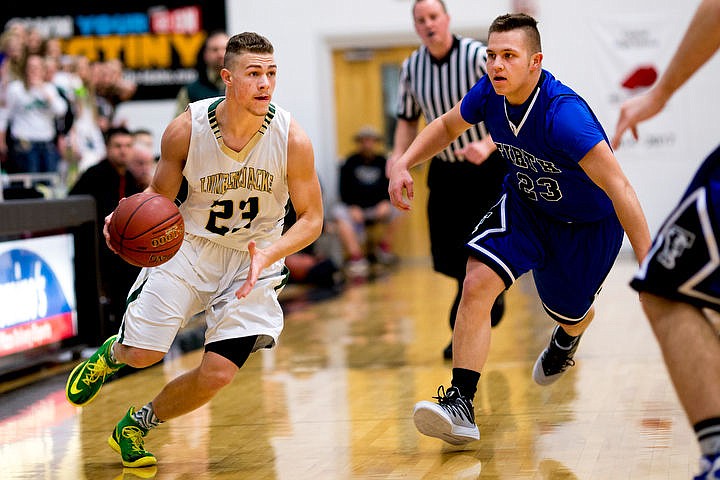 &lt;p&gt;St. Maries post Bryant Asbury drives up the court past Firth guard Dylan Holley at the 2A state semifinal game on Friday at Capital High School in Boise.&lt;/p&gt;