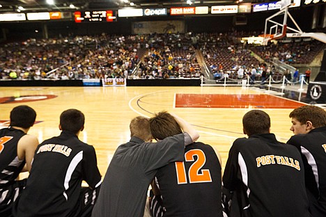 &lt;p&gt;Anthony King, director of operations for the Post Falls boys basketball team, hugs senior Taylor Valente Saturday as the final seconds wind down in the 5A boys state championship game at the Idaho Center in Nampa.&lt;/p&gt;