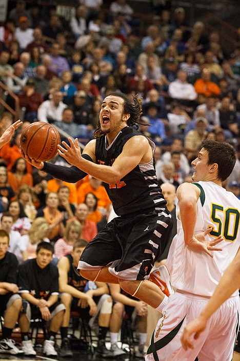 &lt;p&gt;Marcus Colbert, Post Falls High School's star guard, drives to the hoop against Borah in Nampa.&lt;/p&gt;