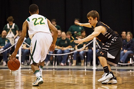 &lt;p&gt;Taylor Valente, of Post Falls, guards Borah's Isaiah Wright in the second half of the 5A boys state championship game.&lt;/p&gt;